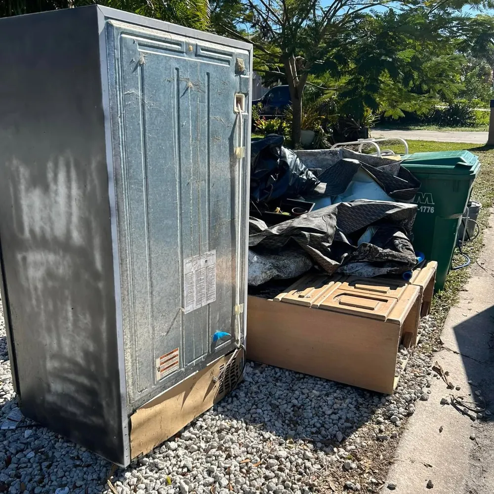 Organized lineup of accepted junk removal items in a Tulsa driveway